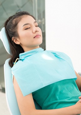 Woman receiving IV sedation in Dallas at the dentist